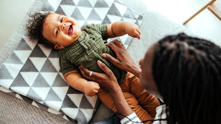 Smiling baby and mother.