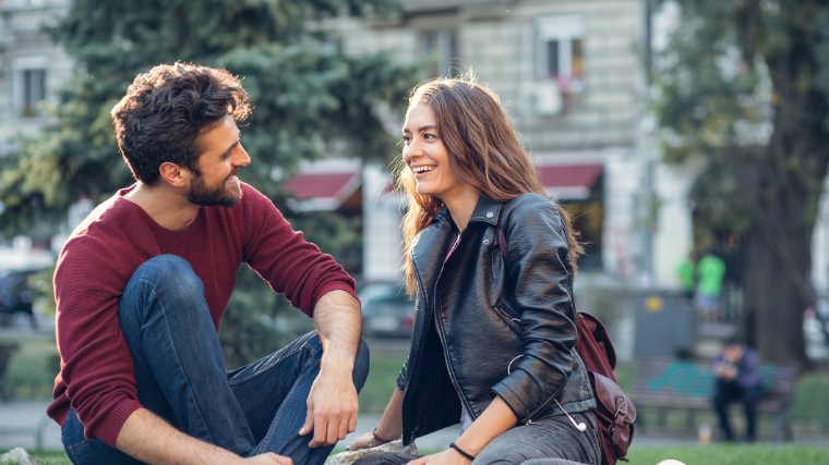 Young couple on date in the park.