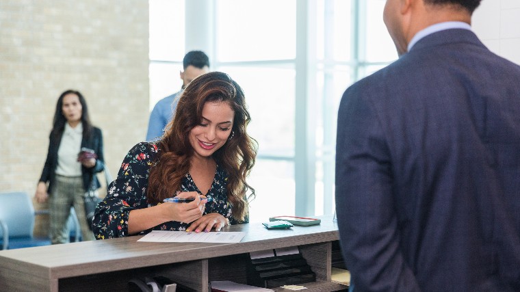 Woman opening an account at the bank.
