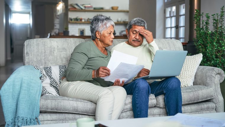 Senior couple reviewing finances together.