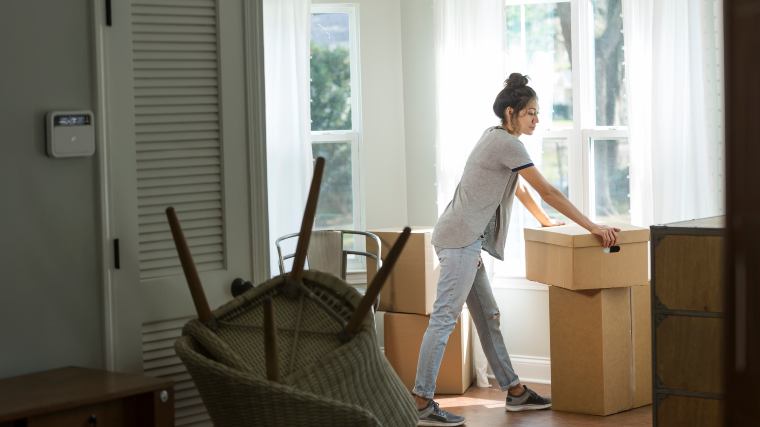young woman moving out of an apartment