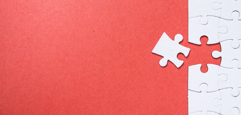 Jigsaw on red background