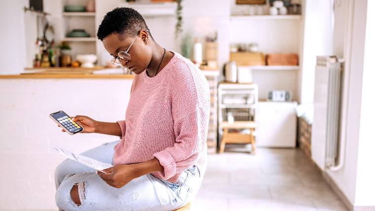Woman reviewing financial documents.