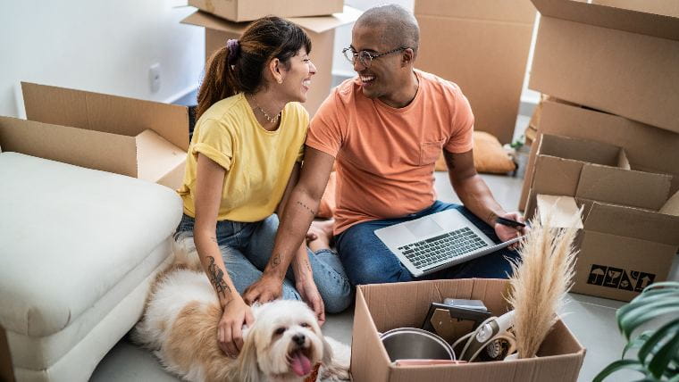 Couple unpacking in new house.