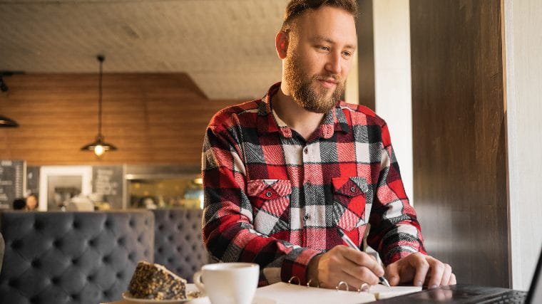 Man with laptop doing research.