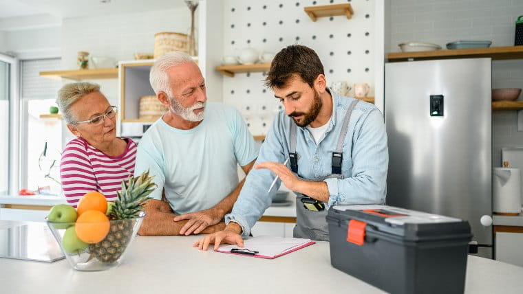 Contractor providing estimate to senior couple.