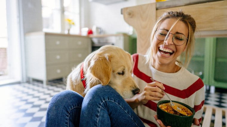 Laughing woman and her dog.