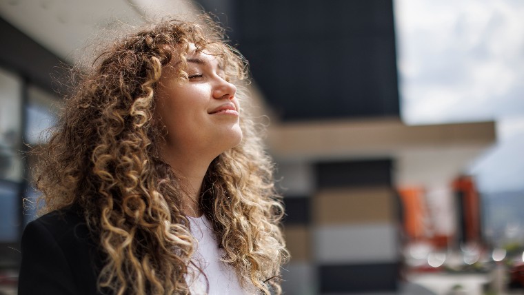 Young woman looking happy and relaxed.