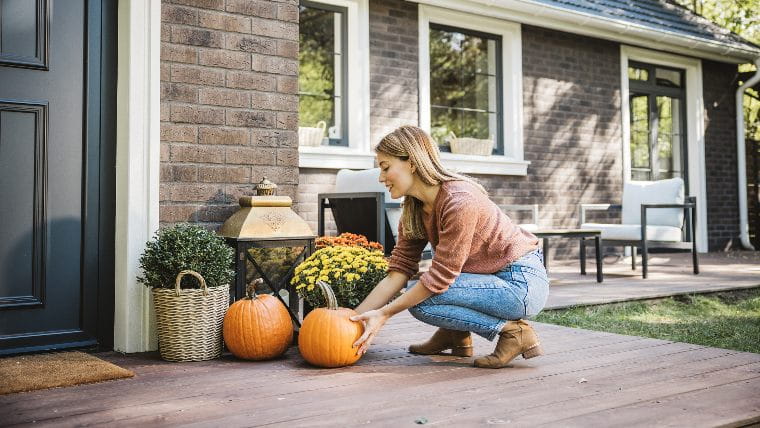 Woman decorating house for the fall.