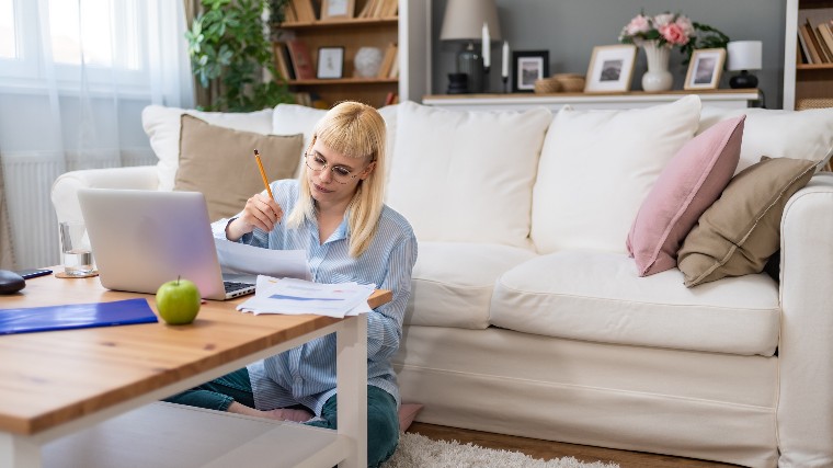 Young woman paying her bills.