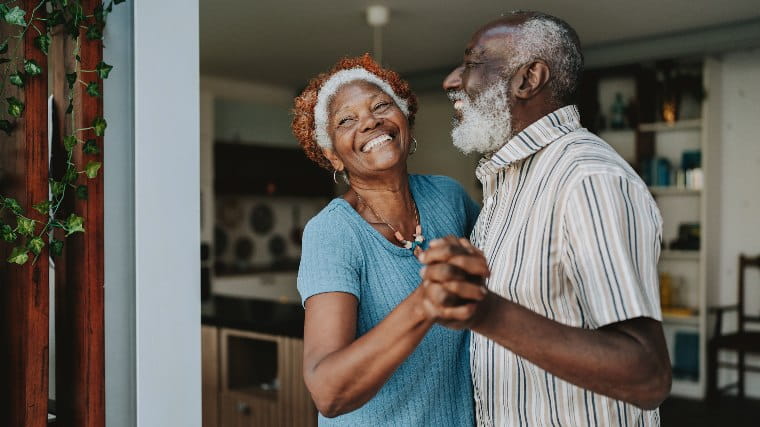 Senior couple dancing together.