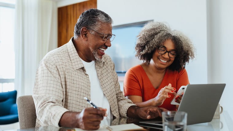 Senior couple reviewing finances together.