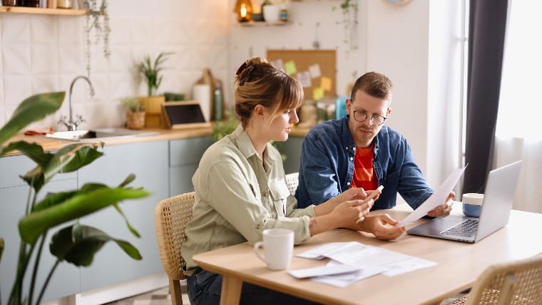 Young couple working on their finances together.