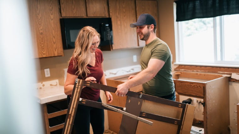 Couple renovating their kitchen.