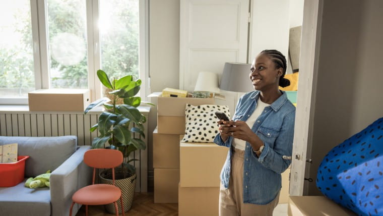 Young woman moves into new apartment.