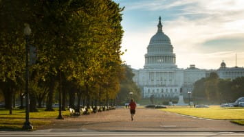 Man jogging in front of national mall in Washington, D.C.