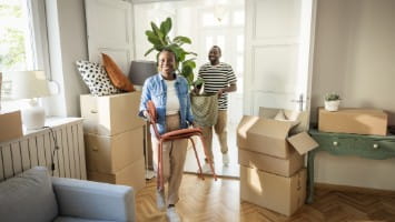 Young couple moving into new home.