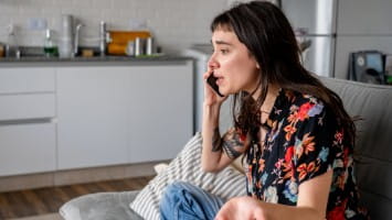 Young woman having heated conversation on the phone.