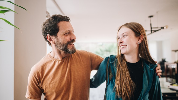 Father and young adult daughter.