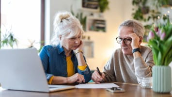 Senior couple reviewing finances together.