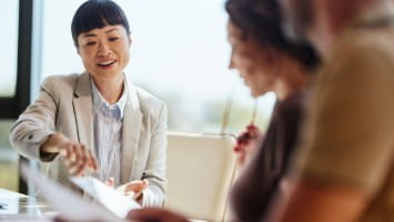 Attorney speaking to two clients.
