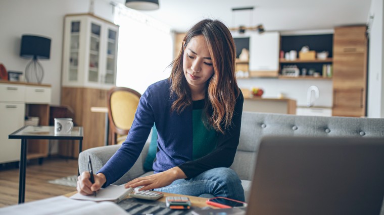 Young woman preparing her taxes.