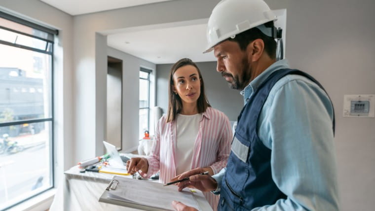 Woman talking to contractor.