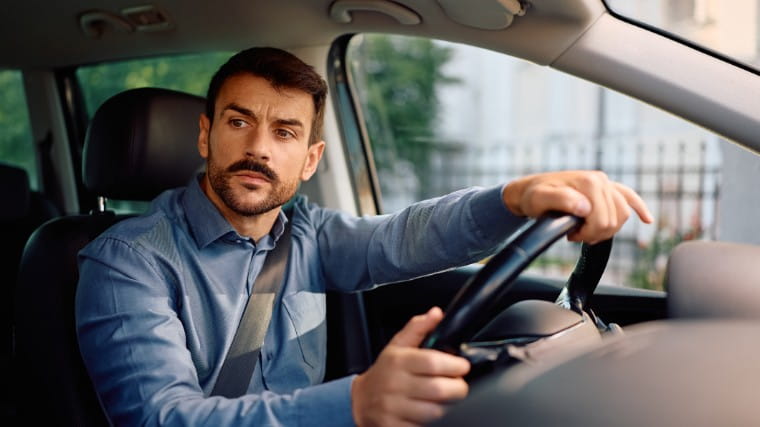 Man driving car.