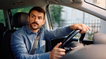 Man driving car.