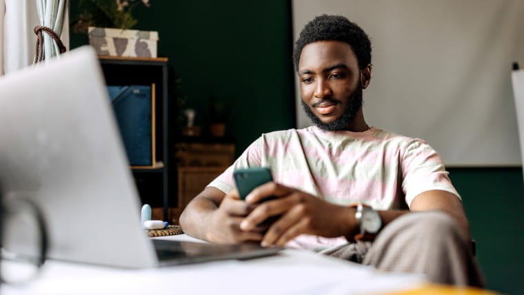 Young man checking phone.
