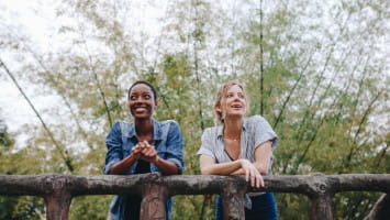 Two women having a conversation outdoors.