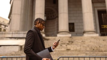 Young man walking to courthouse.