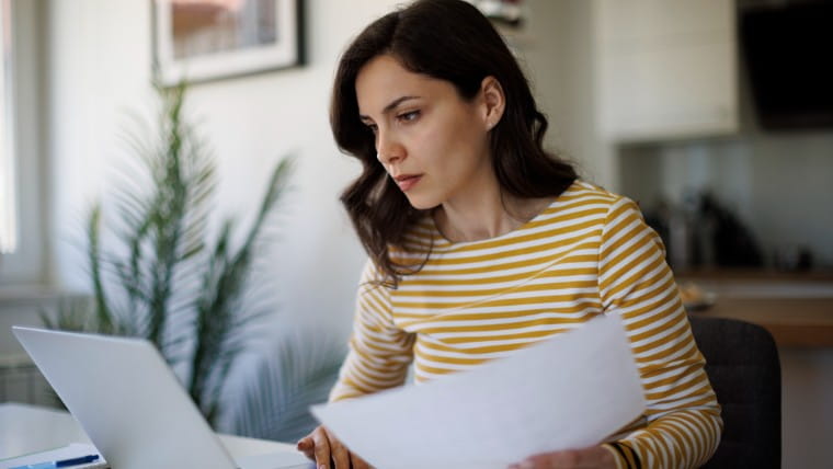 Young woman reviewing documents.