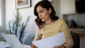 Young woman reviewing documents.