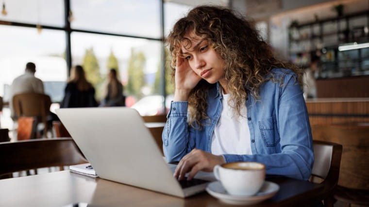 Young woman working on laptop.
