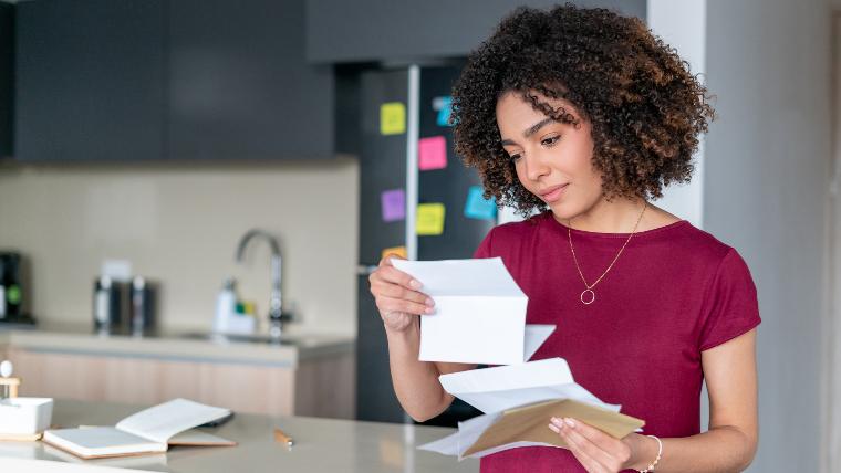 Woman reading bill.