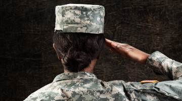 female soldier salutes