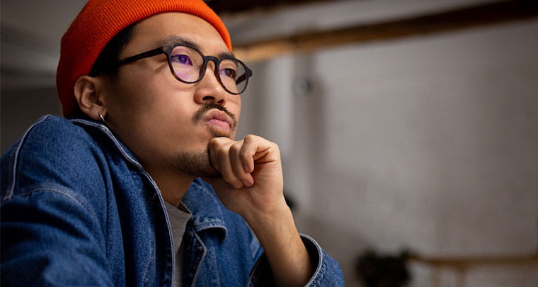 Asian man thinking