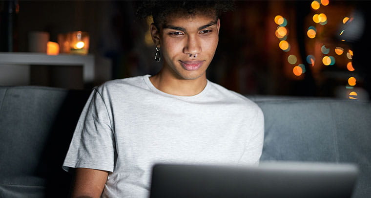 Young Millennial working at computer