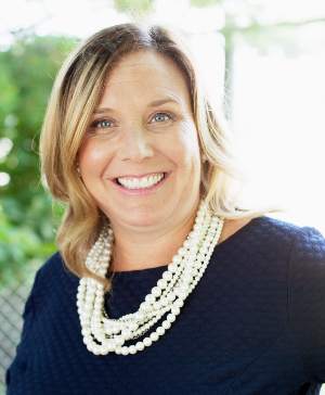 A corporate headshot of Maura Attardi.