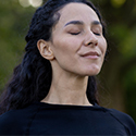 Woman feeling a sense of relaxation and relief after engaging with MMI