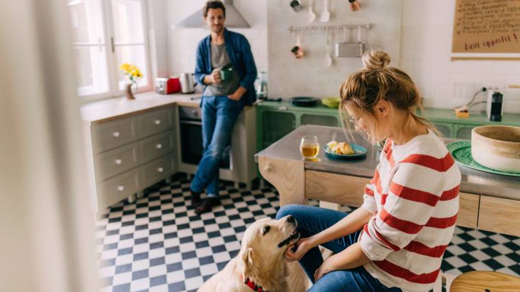 couple hanging out in kitchen of apartment