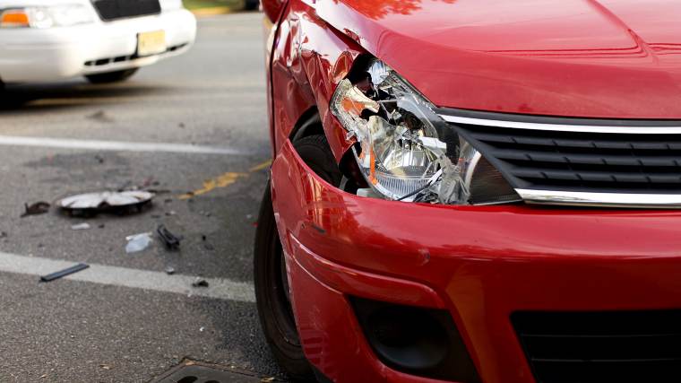 a car with a broken headlight