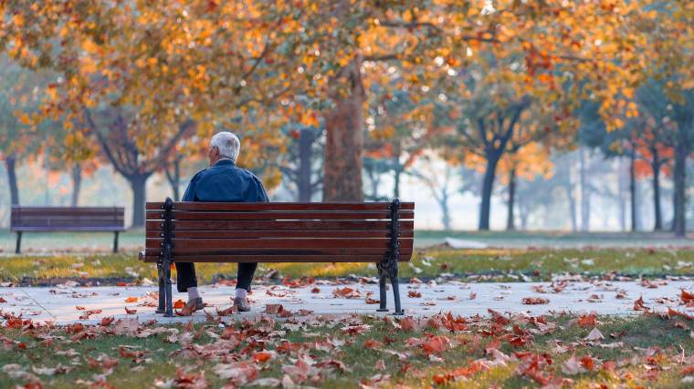 senior sitting on a bench