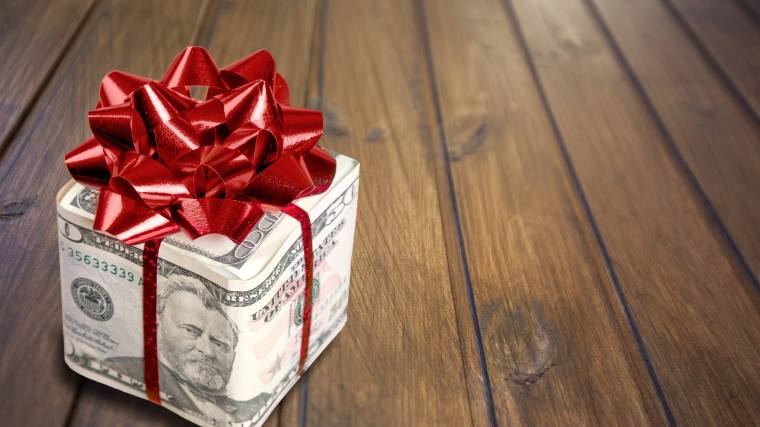 wrapped gift of dollar bills
