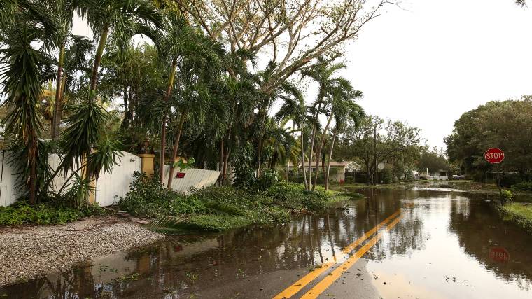 Cars on a flooded road.