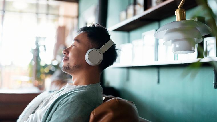 Calm man wearing headphones.