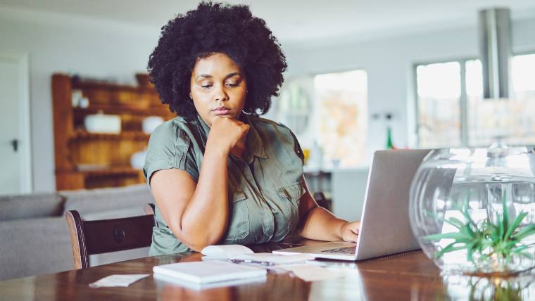 Woman reviewing her bills.