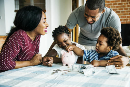 Happy family with piggy bank