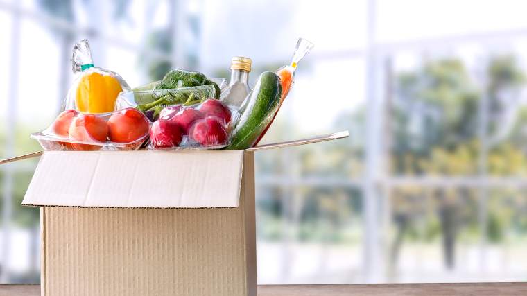 A box full of individually wrapped ingredients from a weekly meal kit.